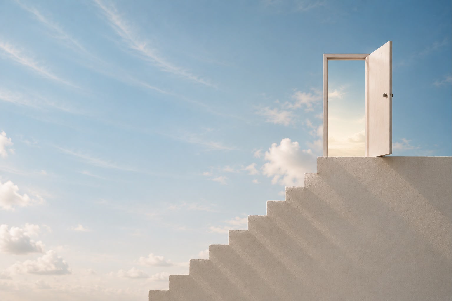 A pale stone staircase rising against a blue sky towards an open doorway.